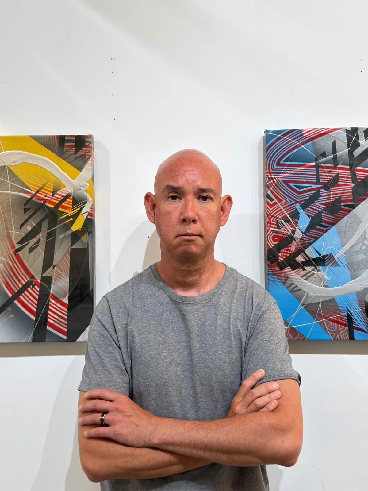 Colin Goldberg standing between Convergence on the left and Passage on the right.